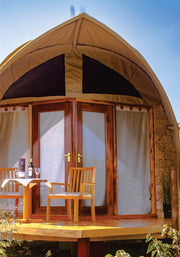 Perfect view of wine table setting on wooden verandah near in tented camp with beige canvas on 3 nights accommodation in Masai Mara